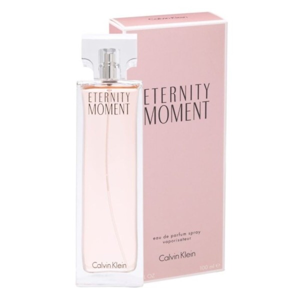 A 100ml bottle of Calvin Klein Eternity Moment Eau de Parfum Spray, featuring an elegant rectangular design with a soft pink hue. The bottle reflects the romantic and timeless floral fragrance, perfect for women who embrace elegance and love.