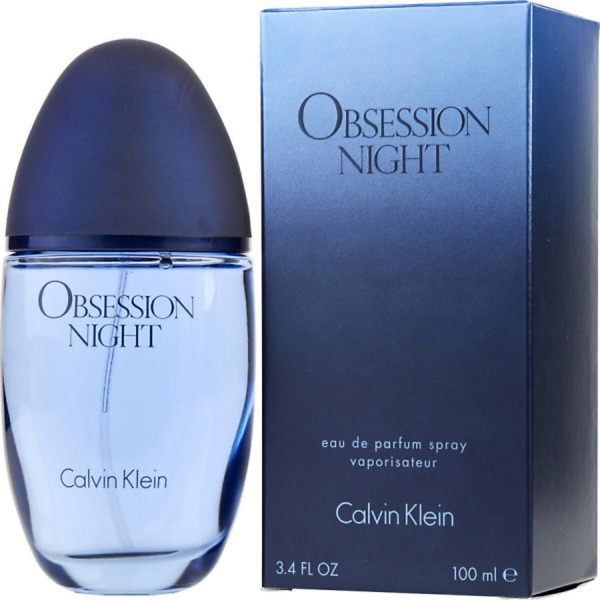 A 100ml bottle of Calvin Klein Obsession Night Eau de Parfum Spray, featuring a sleek and modern dark blue glass design with a minimalist silver cap. The bottle reflects the bold, sensual, and oriental fragrance, perfect for confident and sophisticated women.