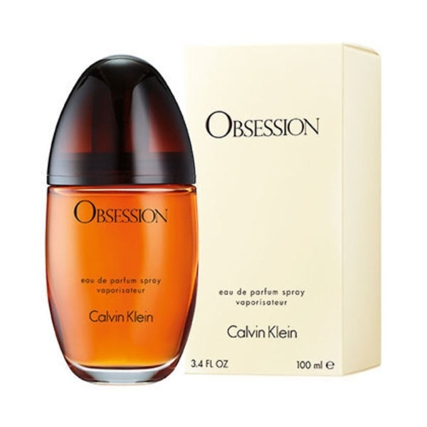 A 50ml bottle of Calvin Klein Obsession Women Eau de Parfum Spray, featuring a classic amber-colored glass design with a rounded cap. The bottle reflects the warm, spicy, and sensual fragrance, perfect for confident and sophisticated women