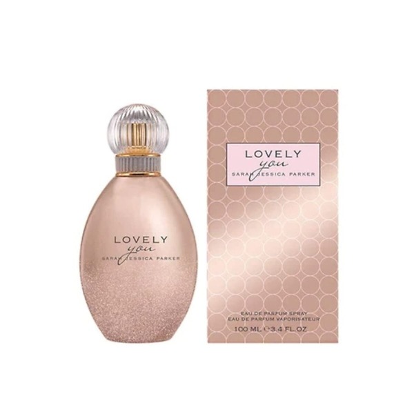 A 100ml bottle of Sarah Jessica Parker Lovely You Eau de Parfum Spray, featuring a sleek and minimalist glass design with a soft pink hue and an elegant silver cap. The bottle reflects the delicate, floral, and musky fragrance, perfect for modern and sophisticated women.